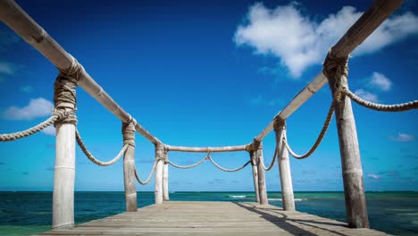 Wood bridge on the beach near the ocean timelapse