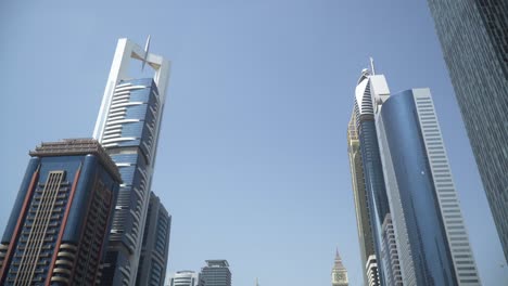 View-of-skyscrapers-from-below-while-driving-through-Dubai