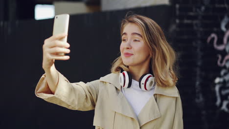 young woman taking a selfie or video call
