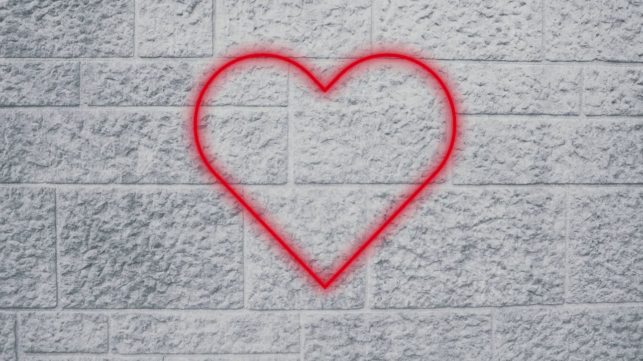 animación de un icono de corazón de neón parpadeante sobre una pared de ladrillo