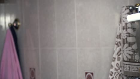 man washing his face