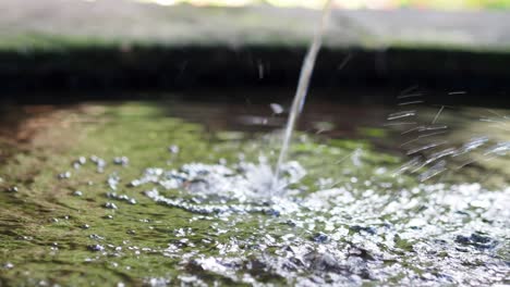 video of some water fountains in a classic university.