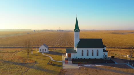 a drone aerial establishing shot over a classic beautiful farmhouse farm and barns in rural midwest america york nebraska 5