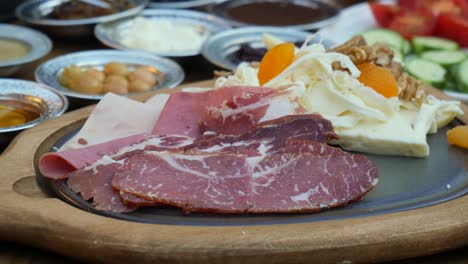 delicious turkish breakfast with cheese, meat, bread and fruit