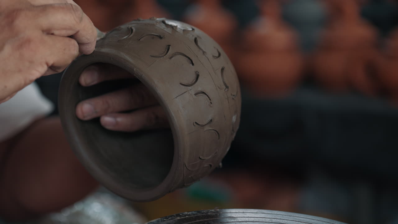 Artisan Shaping Clay Pot