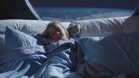 a little girl sleeping in space