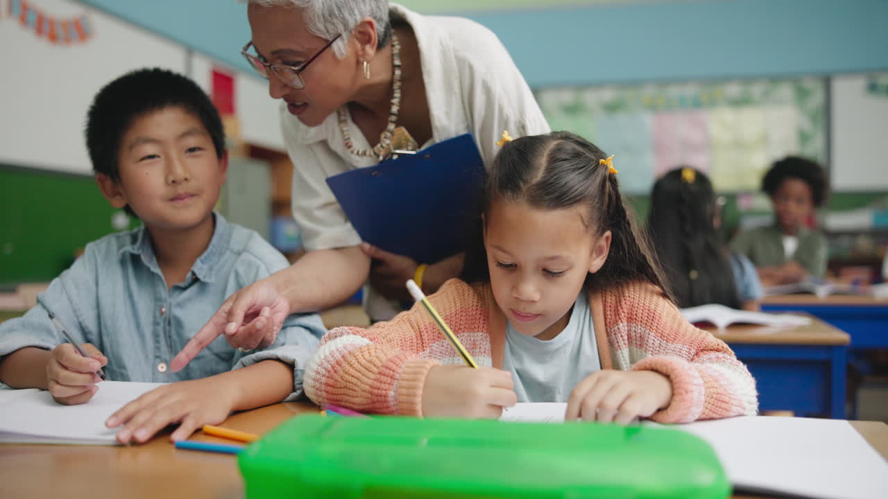 A teacher assisting students in a classroom