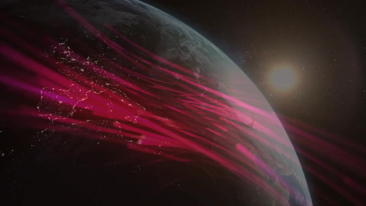 Earth rotating in space, sun rising sending magenta streams across night side, revealing continents