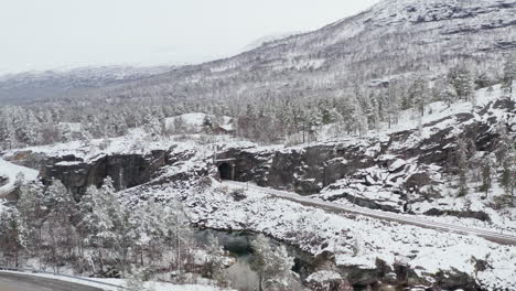 Snowy-Train-Tracks-In-The-Countryside-Of-Dovre,-Innlandet-County,-Norway---aerial-drone-shot