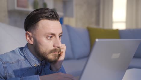 Man-looking-at-computer-screen-is-working-very-carefully.