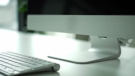 modern computer setup featuring sleek monitor and keyboard in minimalist workspace environment enhancing productivity and aesthetic appeal