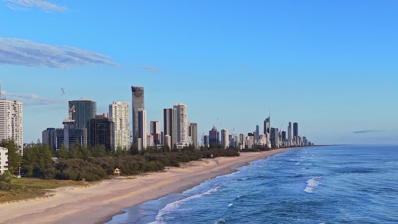 Drone flying in revers along the beach from broad beach to Mermaid