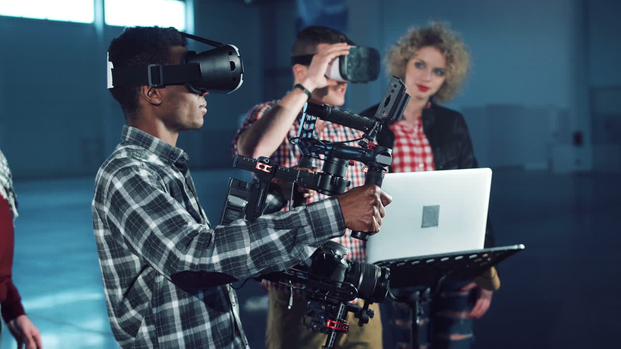 People using virtual reality headsets with camera equipment