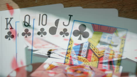 cards game on wooden table with chips and cards on the foreground