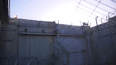 a check point in the security wall which divides israel and palestine