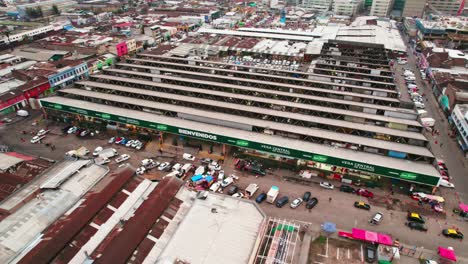 aerial orbitng shot of la vega central market, is the main market for groceries in santiago chile