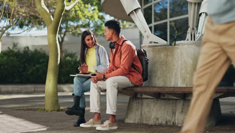 College,-friends-and-talking-on-a-campus-bench