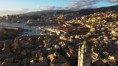 Genoa-city-downtown-area-with-sea-bay-and-docks-in-sunset-light