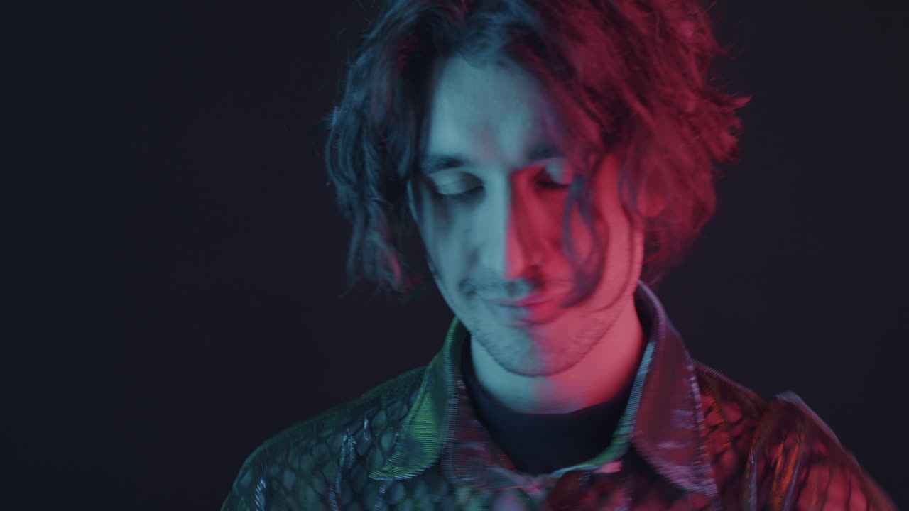 Stylish Man with Vibrant Neon Lighting