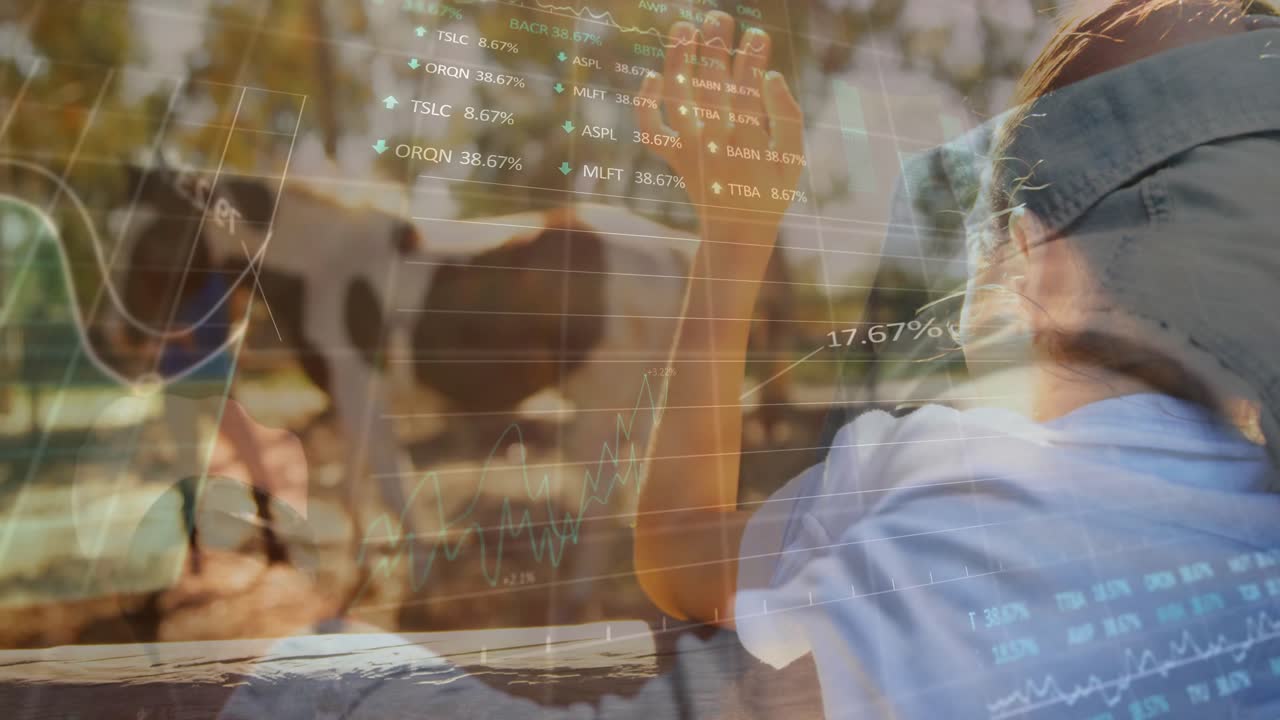 Girl on rail waving at man guiding cow, lifting hand activating farm tech overlay showing 16