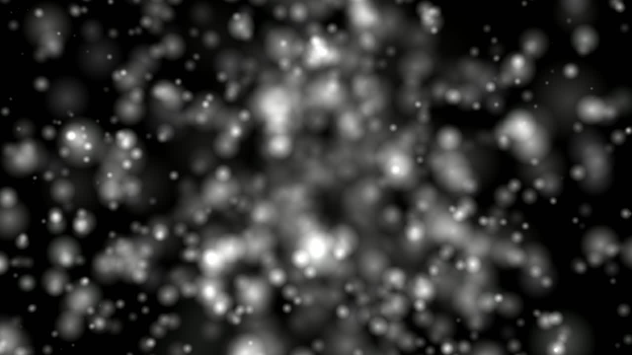 Simulazione di particelle atomiche con particelle in movimento che emanano da un'area centrale
