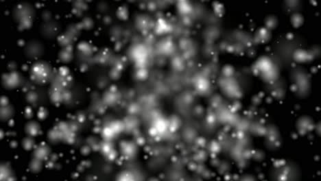 atomic particle simulation with moving particles emanating from central area.
