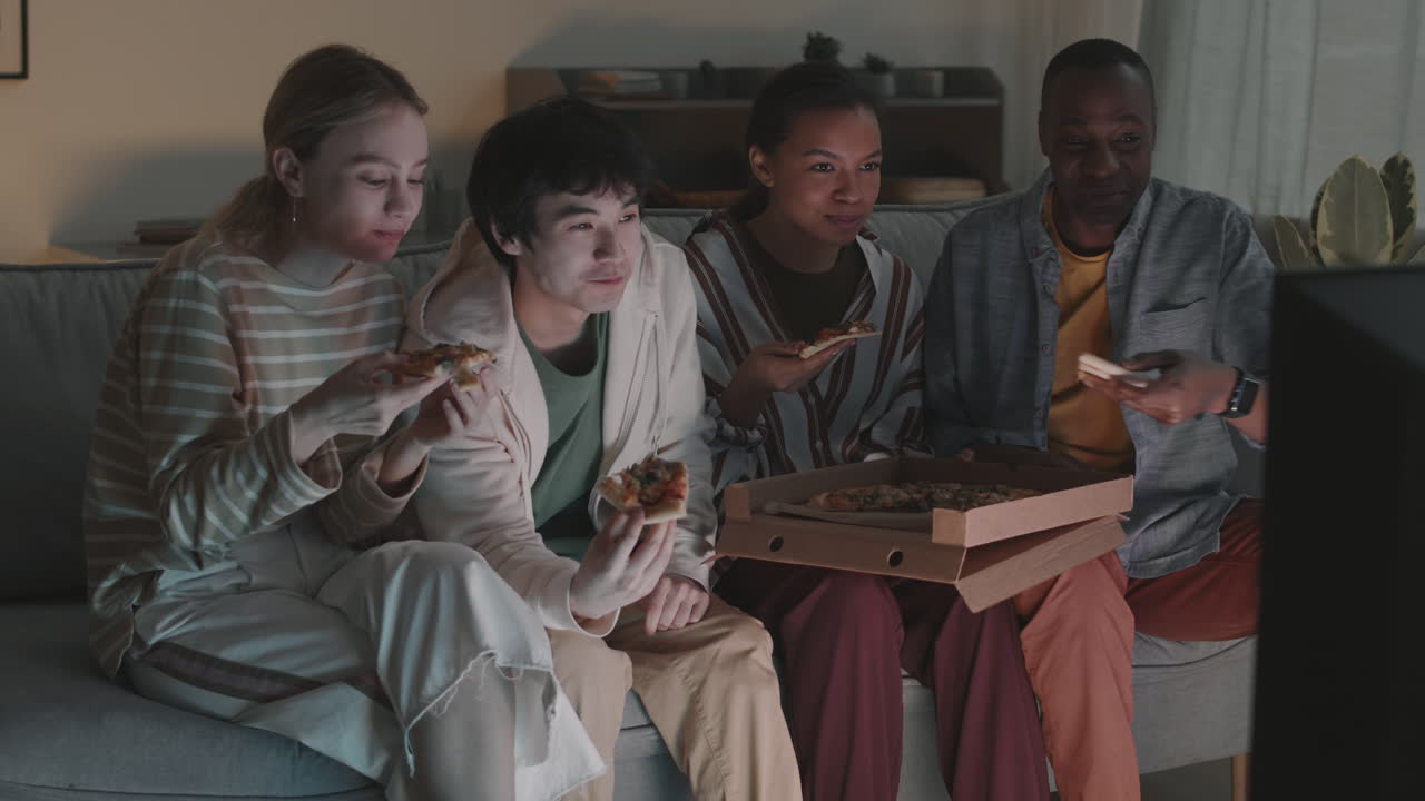 Friends Eating Pizza and Watching TV