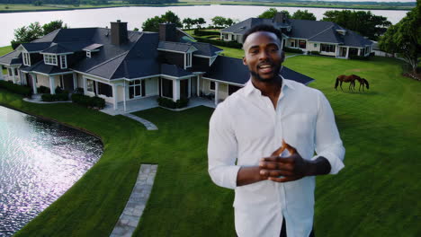 man standing in front of a luxury home