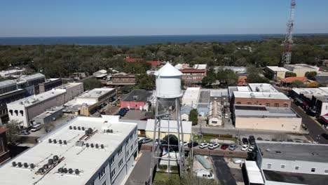 drone flying around water tower in florida town
