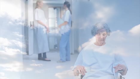 Animation-of-clouds-over-caucasian-nurse-talking-with-patients-in-wheelchair
