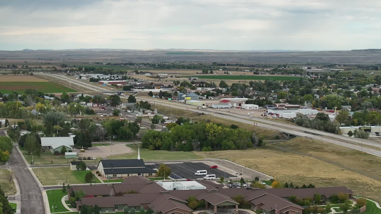 Wheatland Wyoming aerial drone shot including the I25 highway and an overview of the whole town
