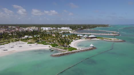 aerial view towards tropical resorts of cap cana marina, punta cana, sunny day in dominican republic