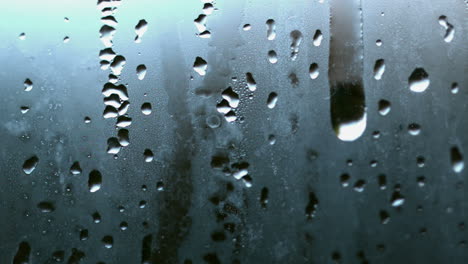 raindrop running down steamy glass