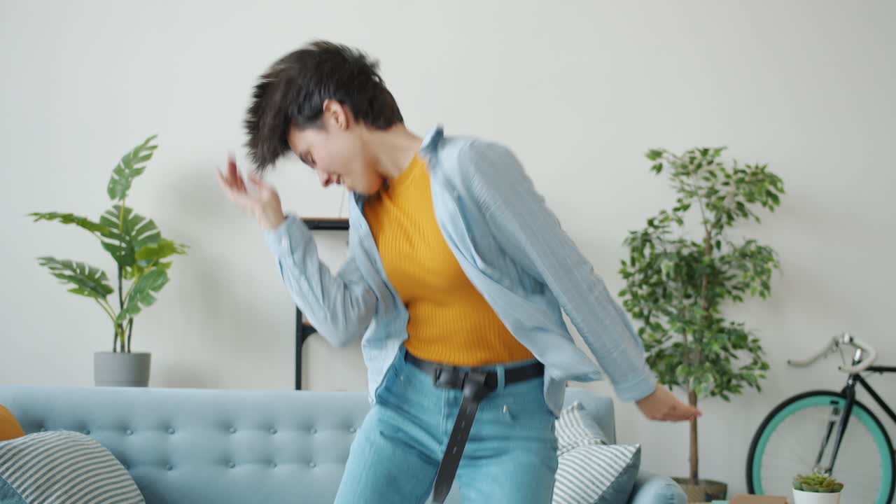 Woman Dancing in Living Room