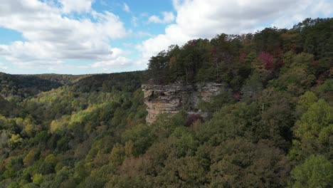 Overlook-in-a-green-valley-with-a-rock-outcropping-on-a-sunny-day-with-blue-skies-and-puffy-white-clouds