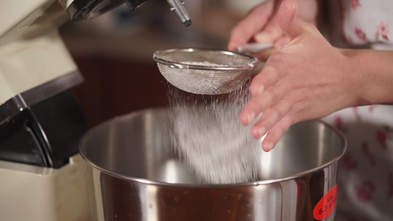 Sifting Flour into Mixing Bowl