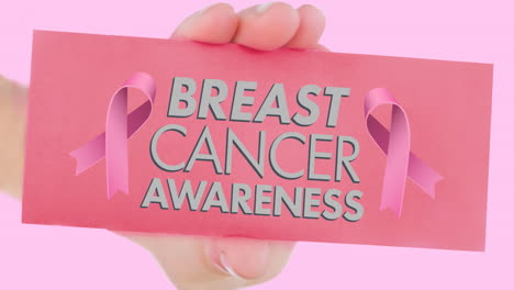 animation of pink ribbon logo with breast cancer text on pink background