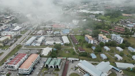 foggy morning beautiful drone view of sri aman town at batang lupar river, during regatta and pesta benak,sarawak, borneo.