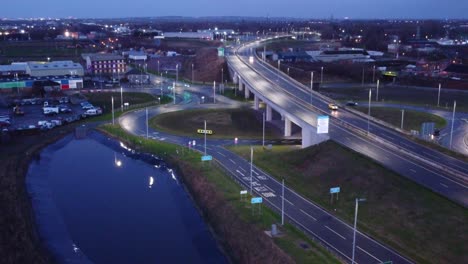 aerial view modern illuminated quiet highway lanes road intersection traffic push in