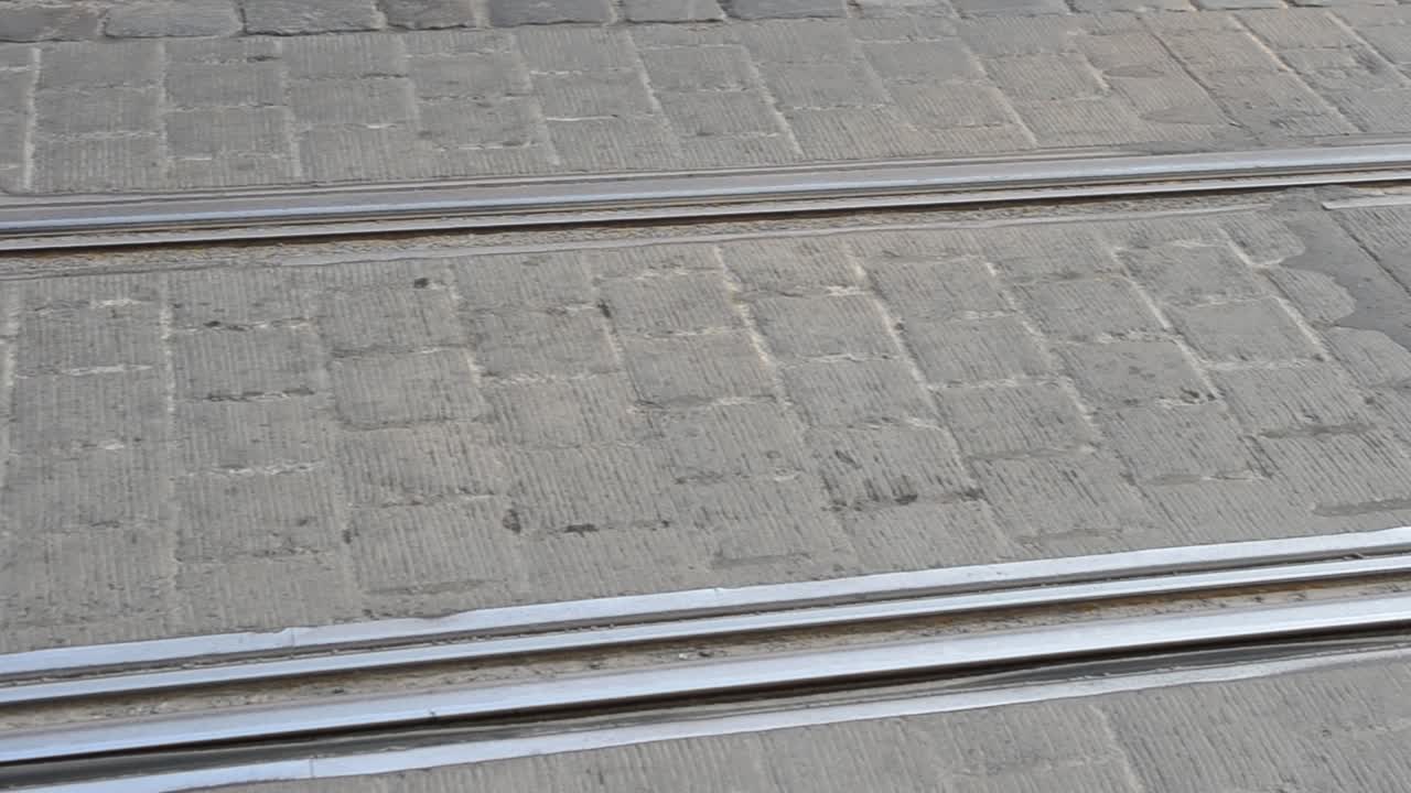 Rails and tram. Pavement in the city