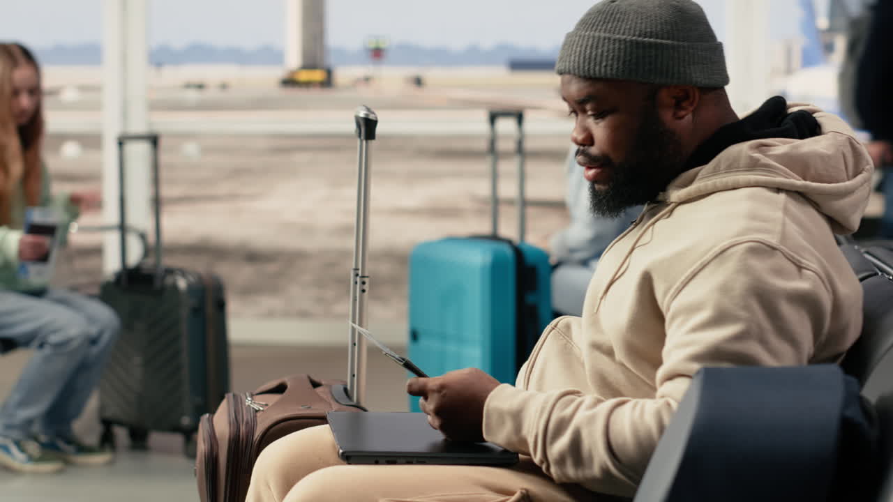 African American Man Checking Travel Documents at Airport