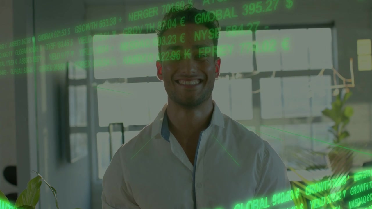 Man in white shirt standing in office, scrolling green finance ticker causing smile and confidence