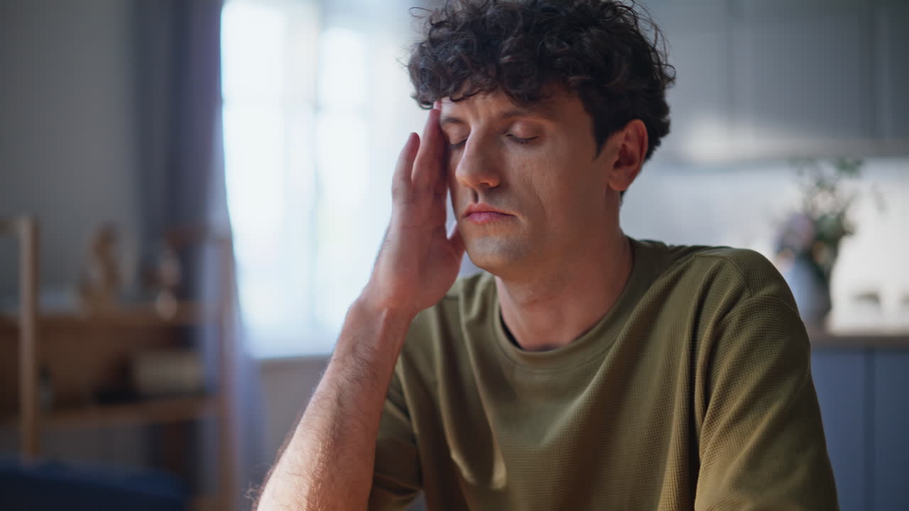 Businessman fingers texting email on laptop keyboard at sunny workspace closeup