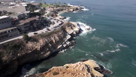 Flying-Above-Sea-Cave-and-Pacific-Ocean,-aerial-of-La-Jolla-Shoreline,-San-Diego-CA-USA