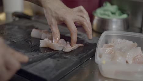 chef preparing fish fillet