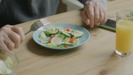 person eating salad