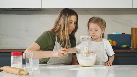 beautiful mother with long hair and little daughter