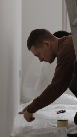 young couple working together on home improvement project