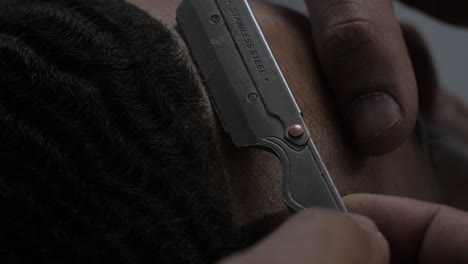 Close-up-of-Barber-Shaving-Client