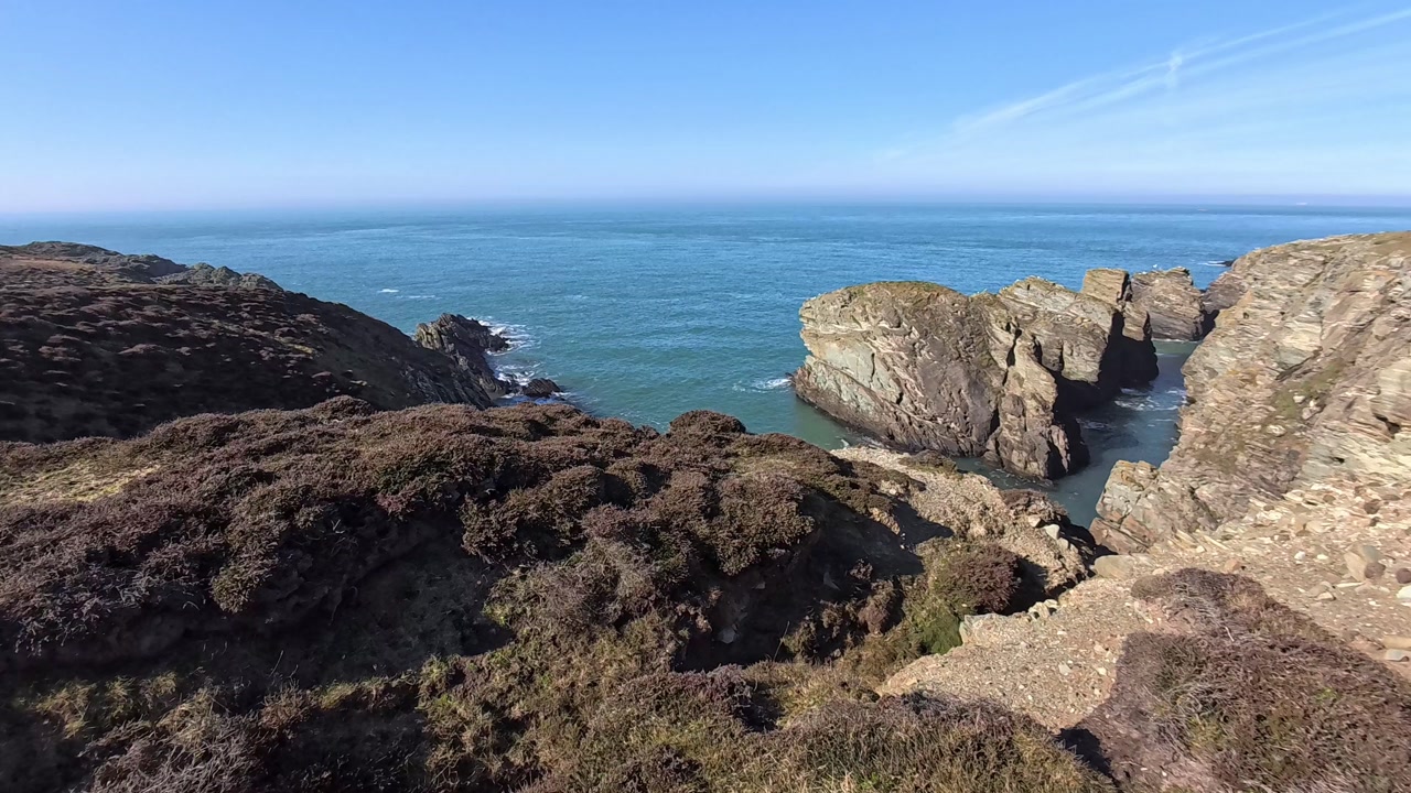 Rugged welsh rocky coast wilderness looking out across the Irish sea towards Ireland